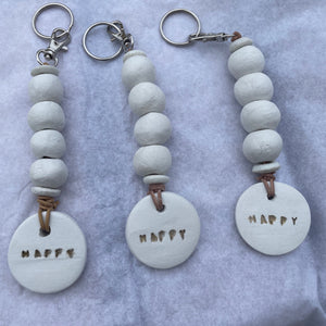 Linen White Clay 'Happy' Keyring/Bag Charm
